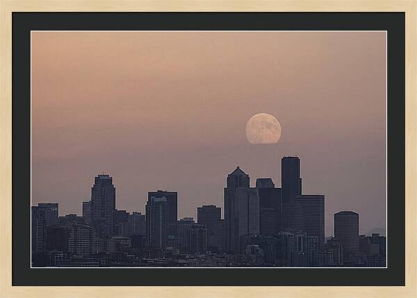 Moonrise Over City Skyline