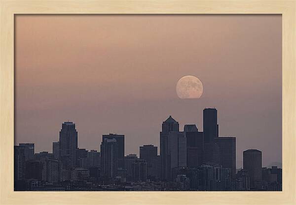 Moonrise Over City Skyline