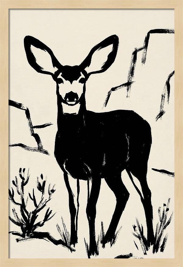 Mule Deer Silhouette Against Rocks