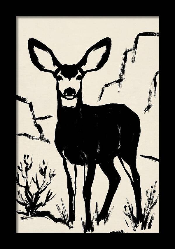 Mule Deer Silhouette Against Rocks
