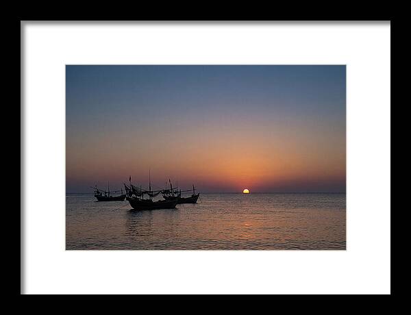 Ocean Sunset With Silhouetted Fishing Boats