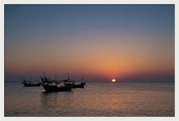 Ocean Sunset With Silhouetted Fishing Boats