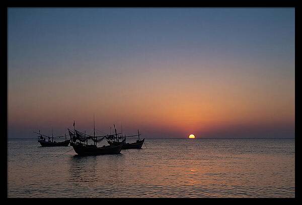 Ocean Sunset With Silhouetted Fishing Boats