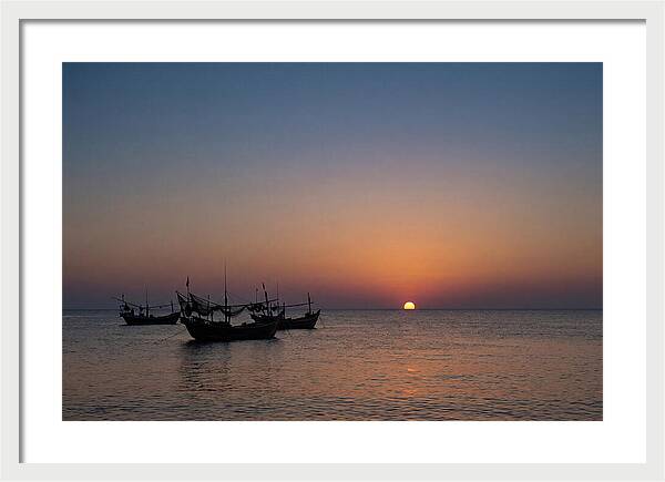 Ocean Sunset With Silhouetted Fishing Boats
