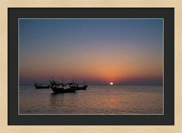 Ocean Sunset With Silhouetted Fishing Boats