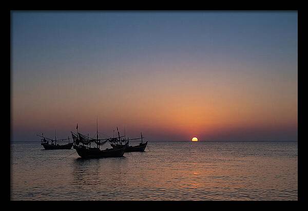 Ocean Sunset With Silhouetted Fishing Boats