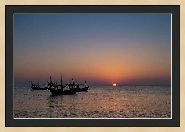 Ocean Sunset With Silhouetted Fishing Boats