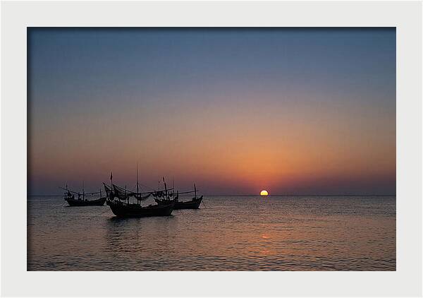 Ocean Sunset With Silhouetted Fishing Boats