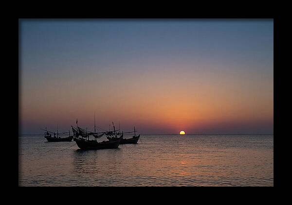 Ocean Sunset With Silhouetted Fishing Boats