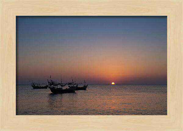 Ocean Sunset With Silhouetted Fishing Boats
