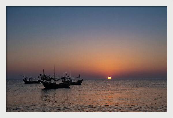 Ocean Sunset With Silhouetted Fishing Boats
