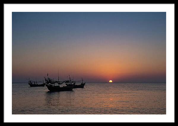 Ocean Sunset With Silhouetted Fishing Boats