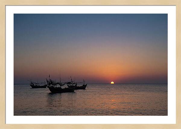 Ocean Sunset With Silhouetted Fishing Boats