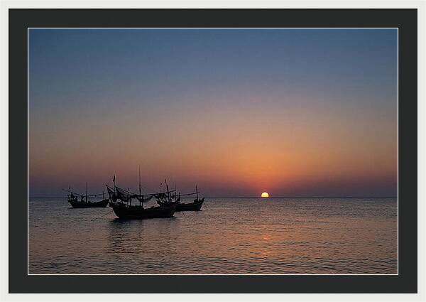 Ocean Sunset With Silhouetted Fishing Boats