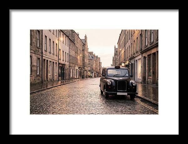 Old British Taxi Cab On Wet Street