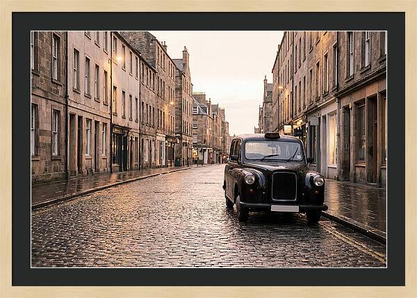 Old British Taxi Cab On Wet Street