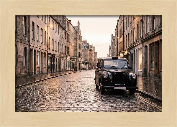 Old British Taxi Cab On Wet Street