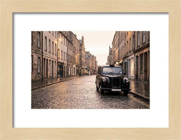Old British Taxi Cab On Wet Street
