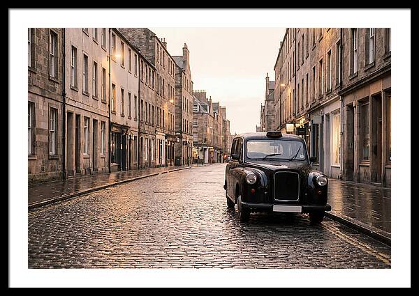 Old British Taxi Cab On Wet Street