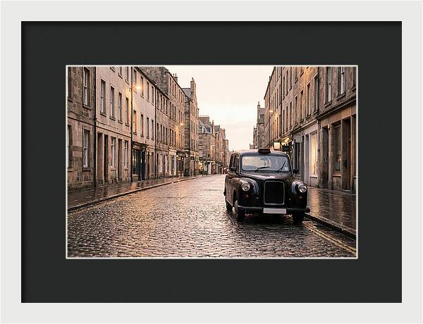 Old British Taxi Cab On Wet Street
