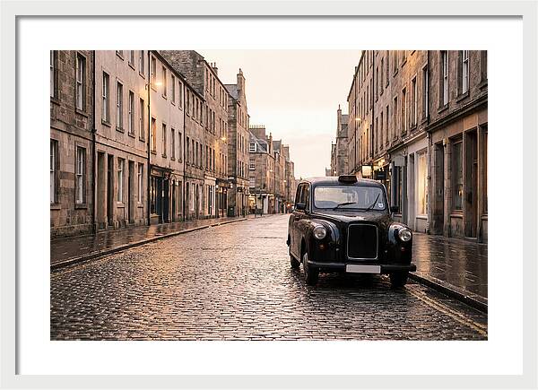 Old British Taxi Cab On Wet Street