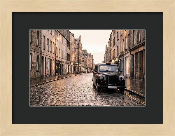 Old British Taxi Cab On Wet Street