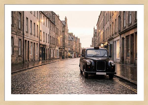 Old British Taxi Cab On Wet Street