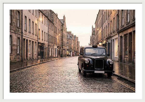 Old British Taxi Cab On Wet Street
