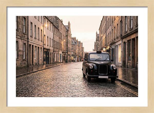 Old British Taxi Cab On Wet Street