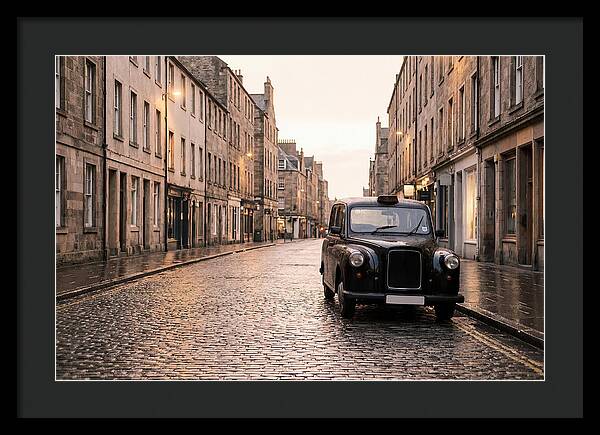 Old British Taxi Cab On Wet Street