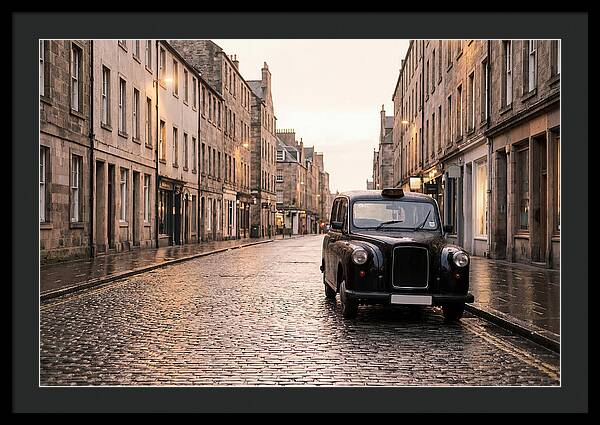 Old British Taxi Cab On Wet Street