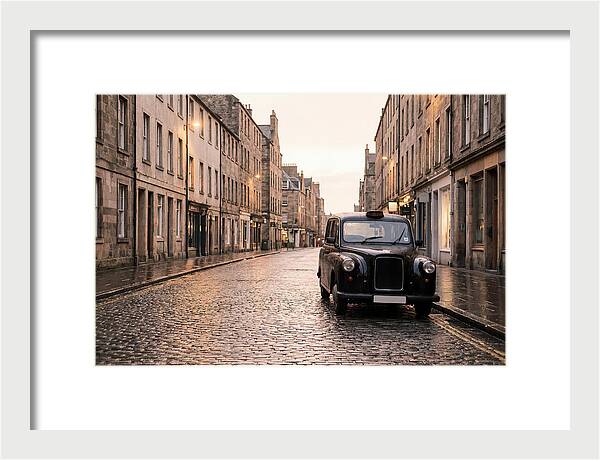 Old British Taxi Cab On Wet Street