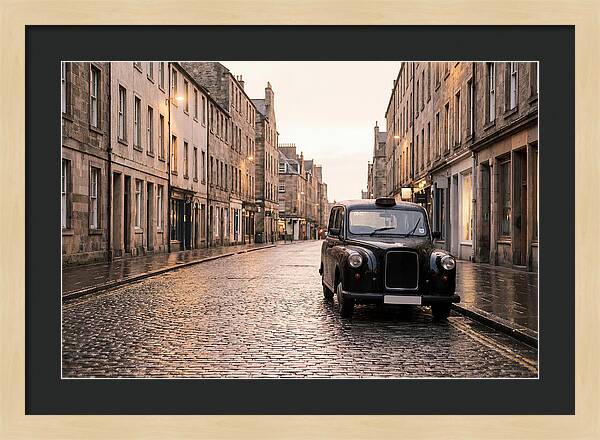 Old British Taxi Cab On Wet Street