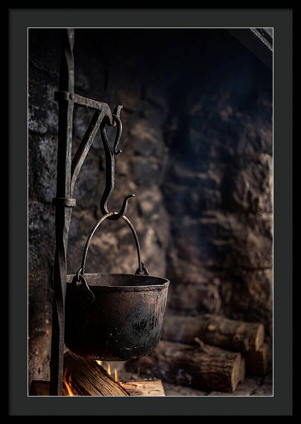 Old Iron Cauldron Hanging In Kitchen