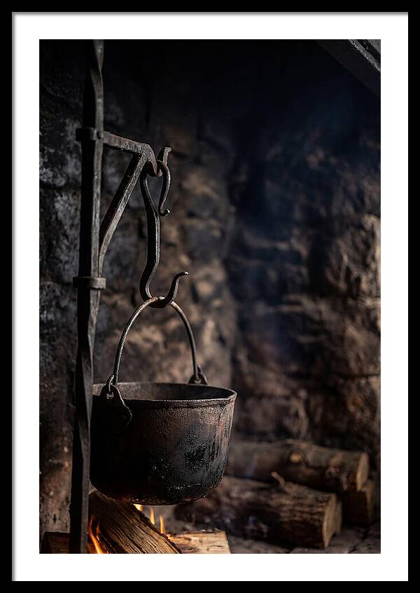 Old Iron Cauldron Hanging In Kitchen