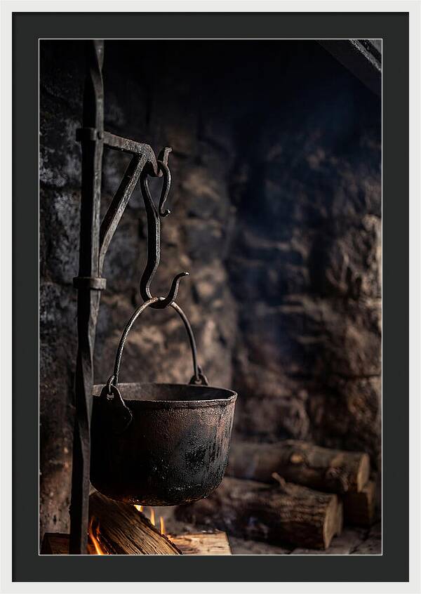 Old Iron Cauldron Hanging In Kitchen