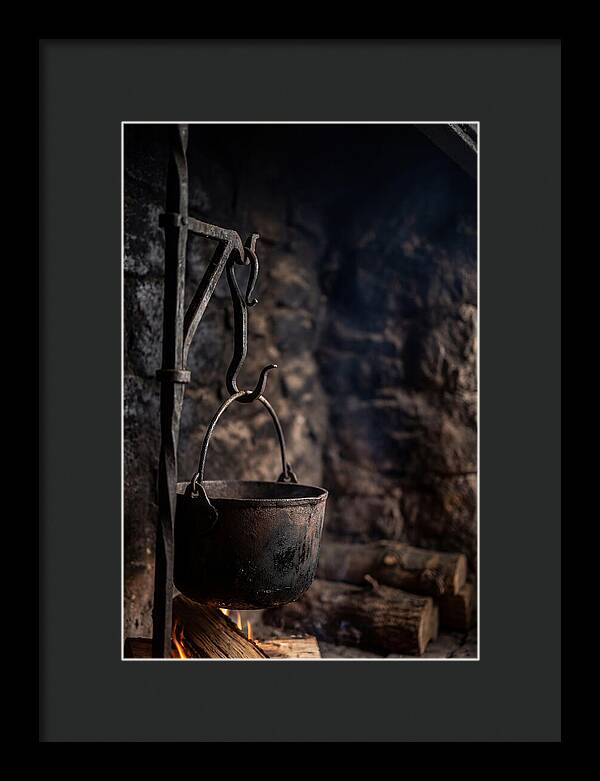 Old Iron Cauldron Hanging In Kitchen