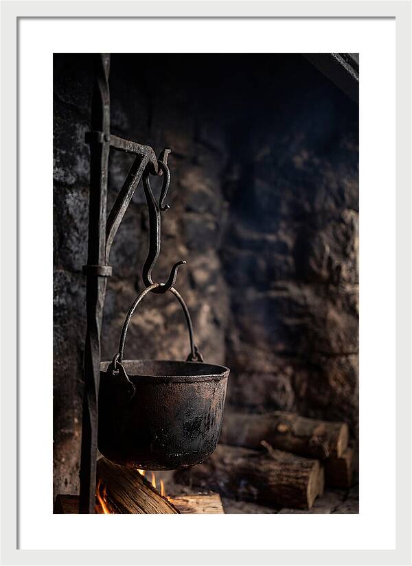 Old Iron Cauldron Hanging In Kitchen