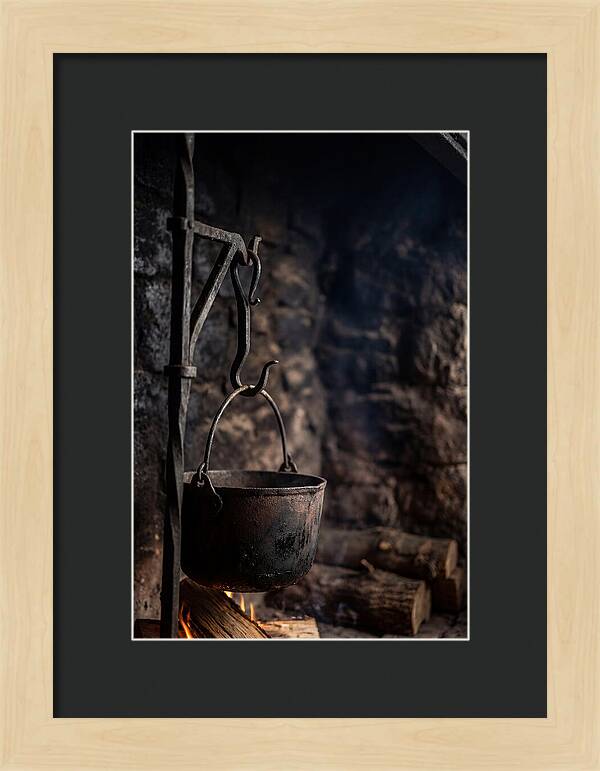 Old Iron Cauldron Hanging In Kitchen
