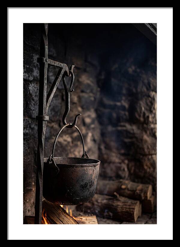Old Iron Cauldron Hanging In Kitchen