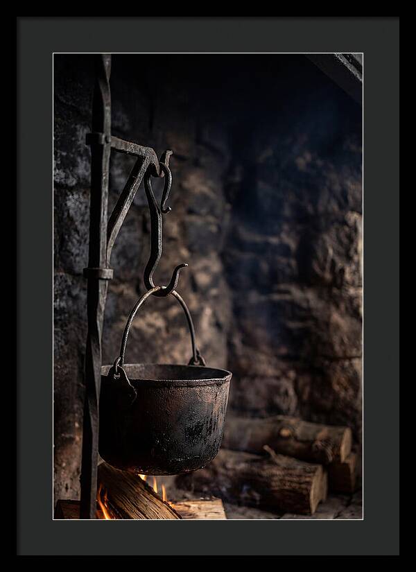 Old Iron Cauldron Hanging In Kitchen