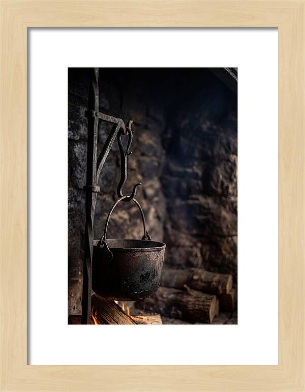 Old Iron Cauldron Hanging In Kitchen
