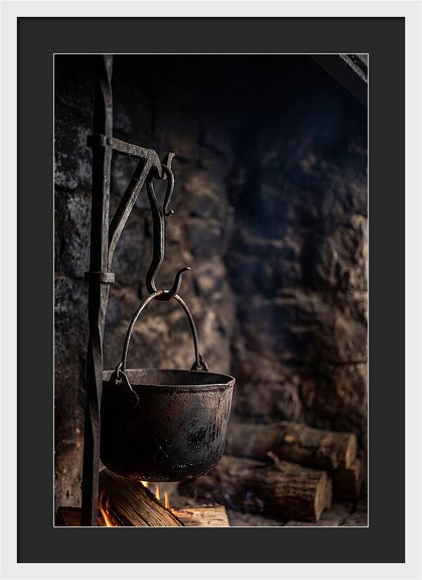 Old Iron Cauldron Hanging In Kitchen