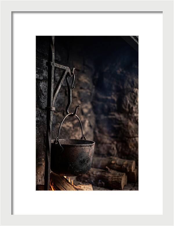 Old Iron Cauldron Hanging In Kitchen