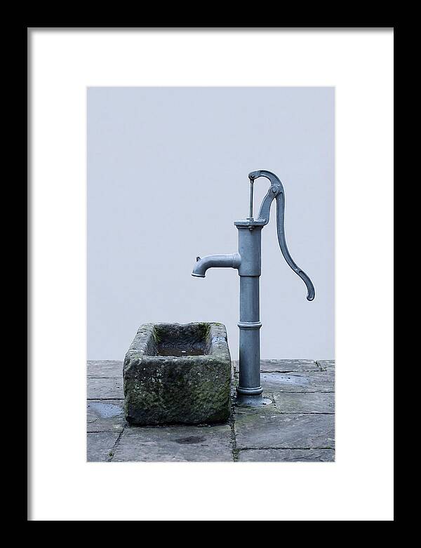 Old Iron Pump Beside Stone Trough