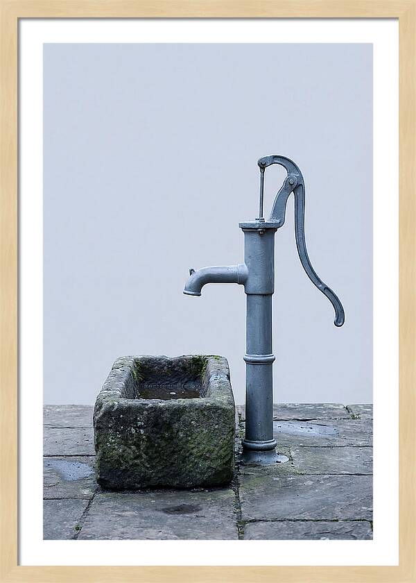 Old Iron Pump Beside Stone Trough