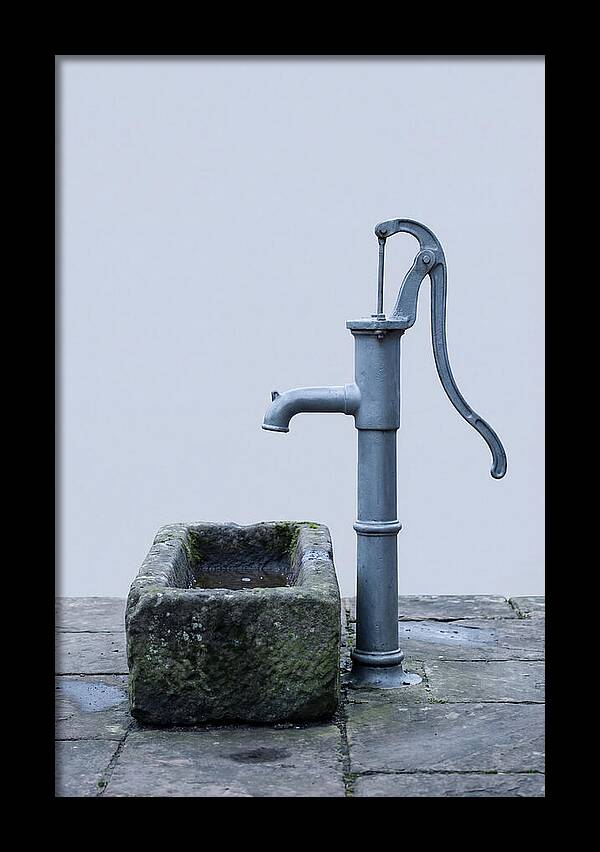 Old Iron Pump Beside Stone Trough