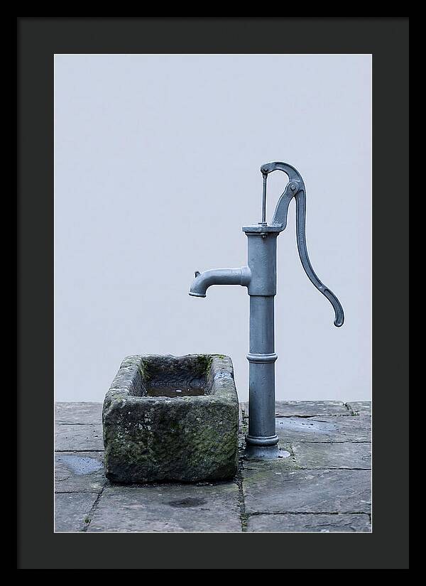 Old Iron Pump Beside Stone Trough