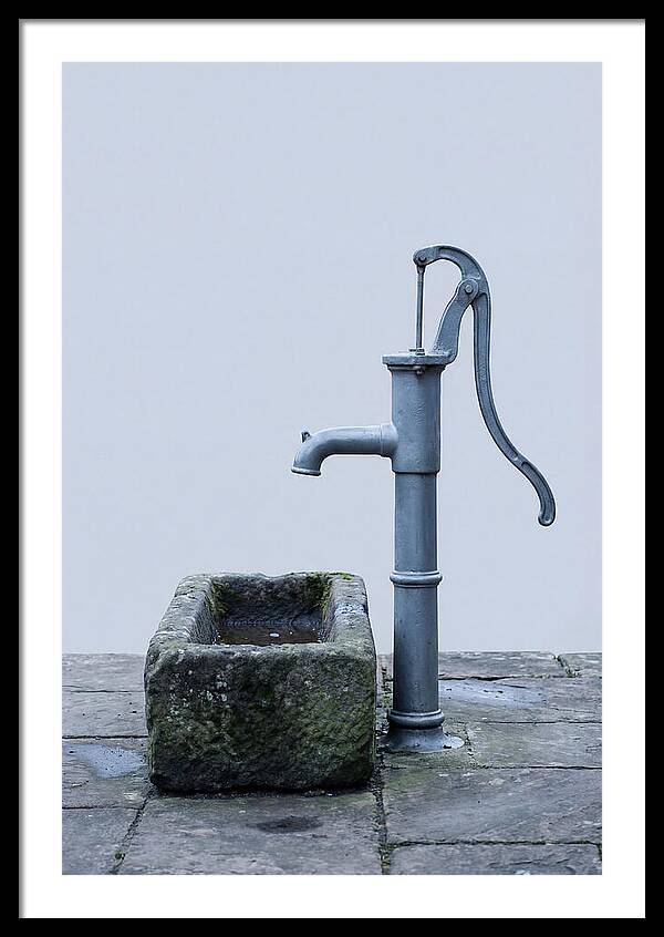 Old Iron Pump Beside Stone Trough