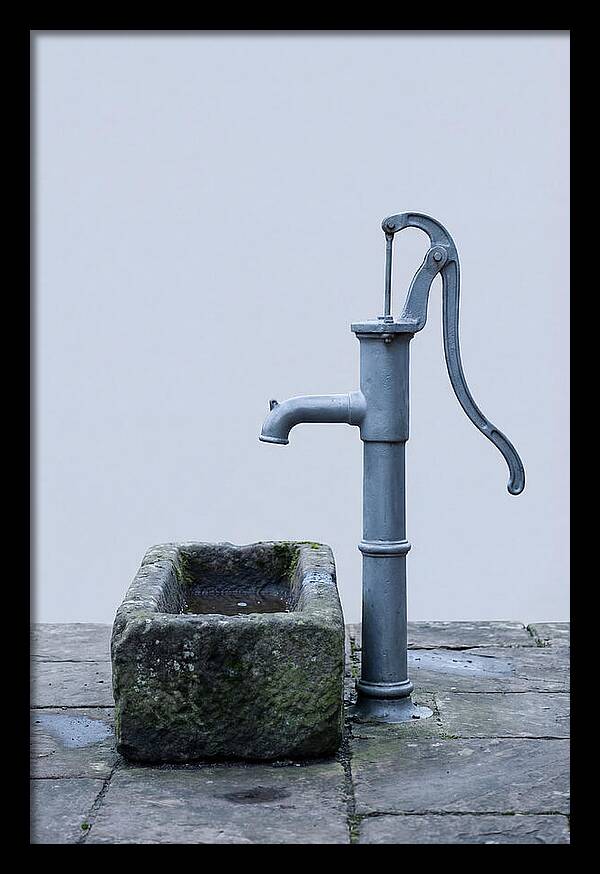 Old Iron Pump Beside Stone Trough